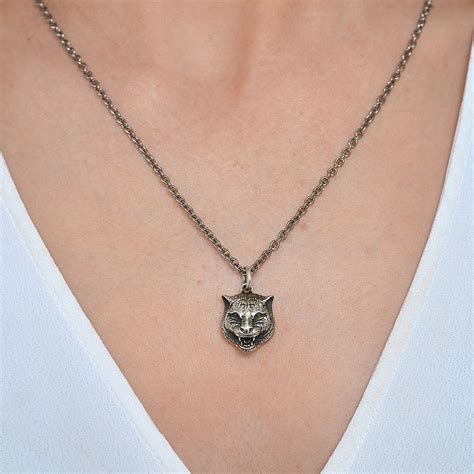 gucci feline necklace.